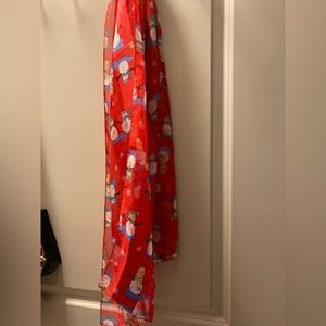 Santa scarf in whimsical patterns and beautiful red tones to pair with coats